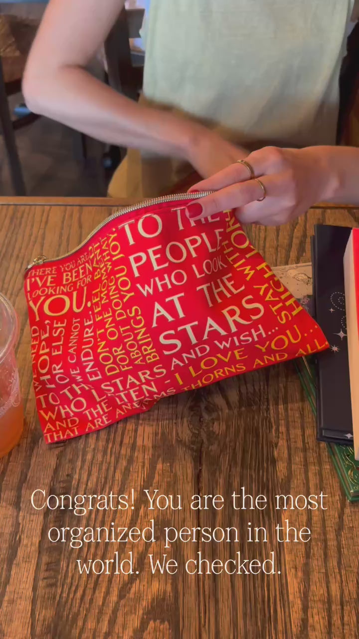 model filling red ASCOR pouch with items