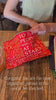 model filling red ASCOR pouch with items
