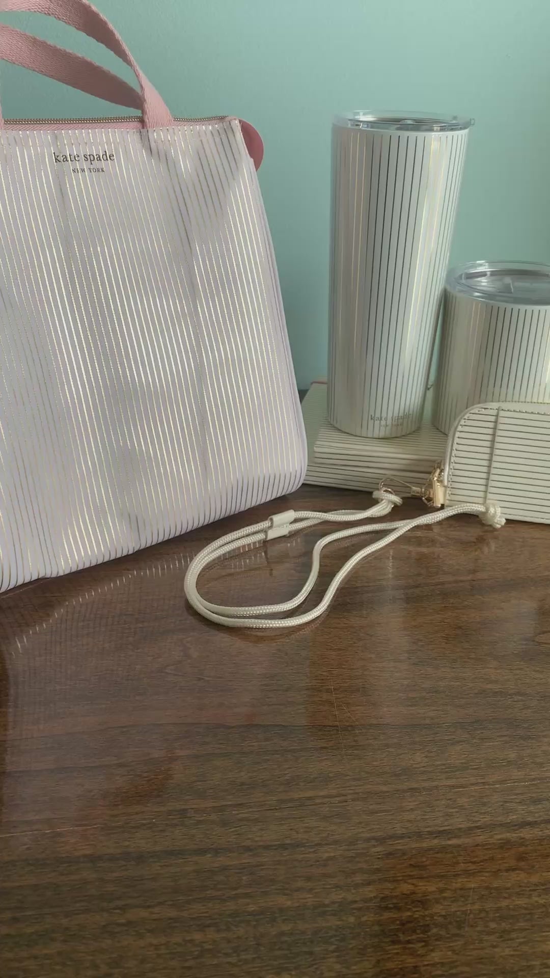 model showcasing metallic gold and white zip lanyard with clear id pocket back