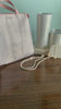 model showcasing metallic gold and white zip lanyard with clear id pocket back
