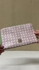 model showcasing pink and green travel wallet