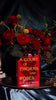 Book-shaped vase with 'A Court of Thorns and Roses' design with  bouquet inside